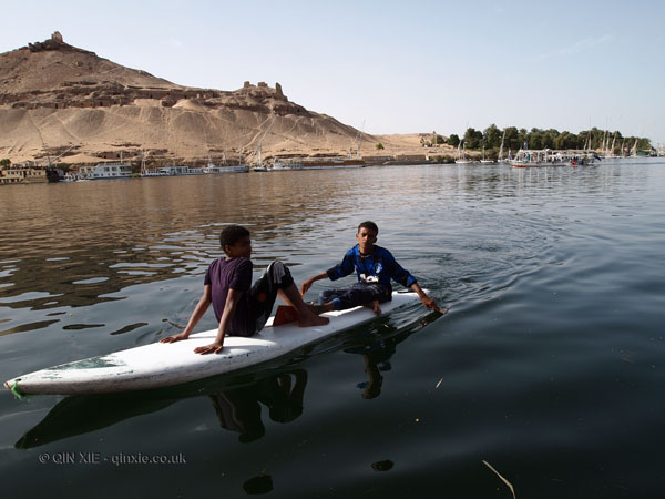 Children on surfboard, Felucca ride on the Nile
