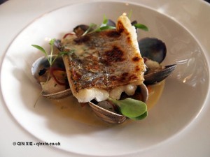 Fillet of hake with clams, cod cheek, mushroom and shallots at Catch and Cook with Simon Hulstone in Torquay